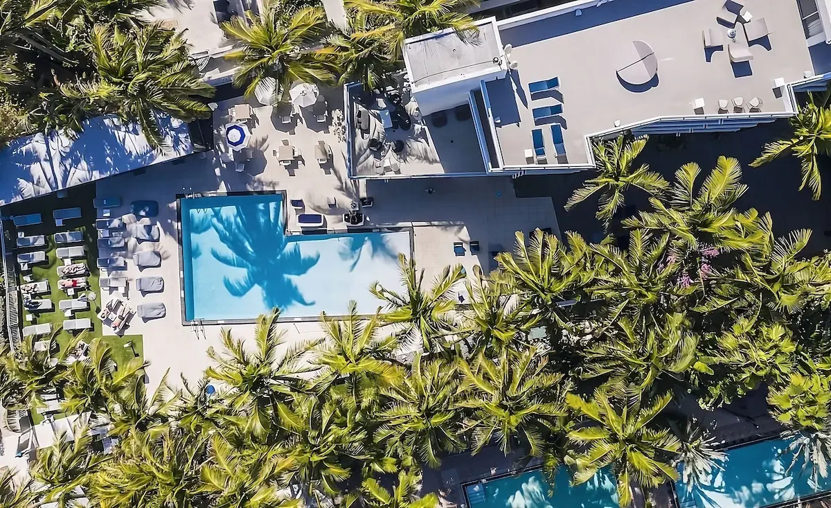 Aerial view of the Sagamore pool and grounds among palms
