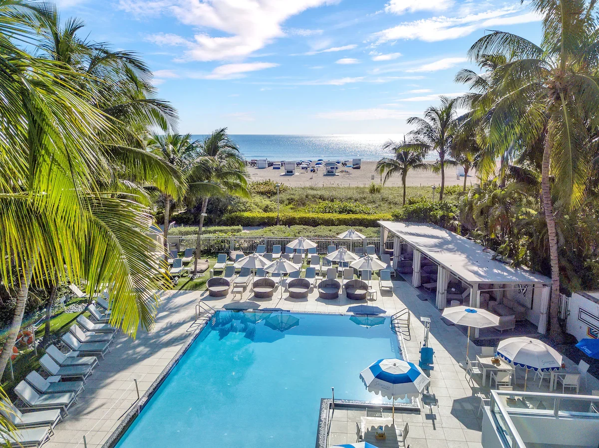 The Sagamore pool with cabanas, dunes and the ocean beyond