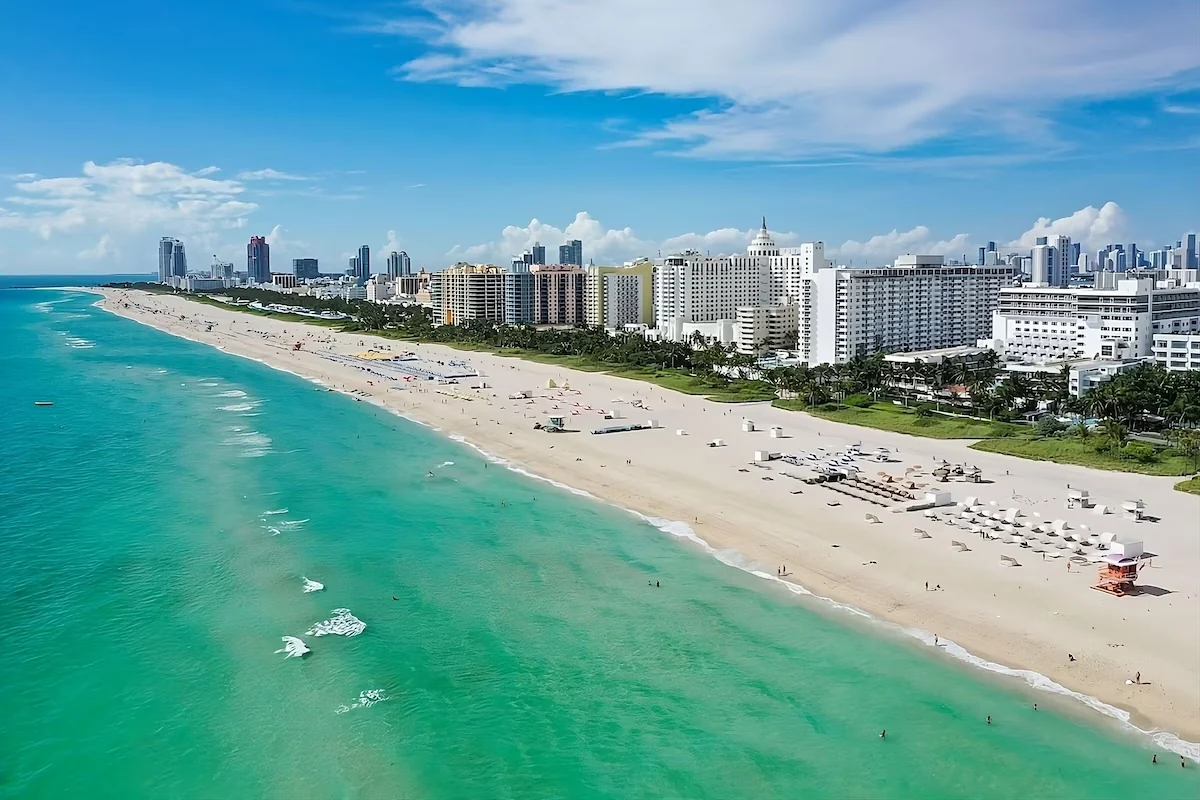 South Beach from the air: the shoreline, the sand and the hotels of Collins Avenue